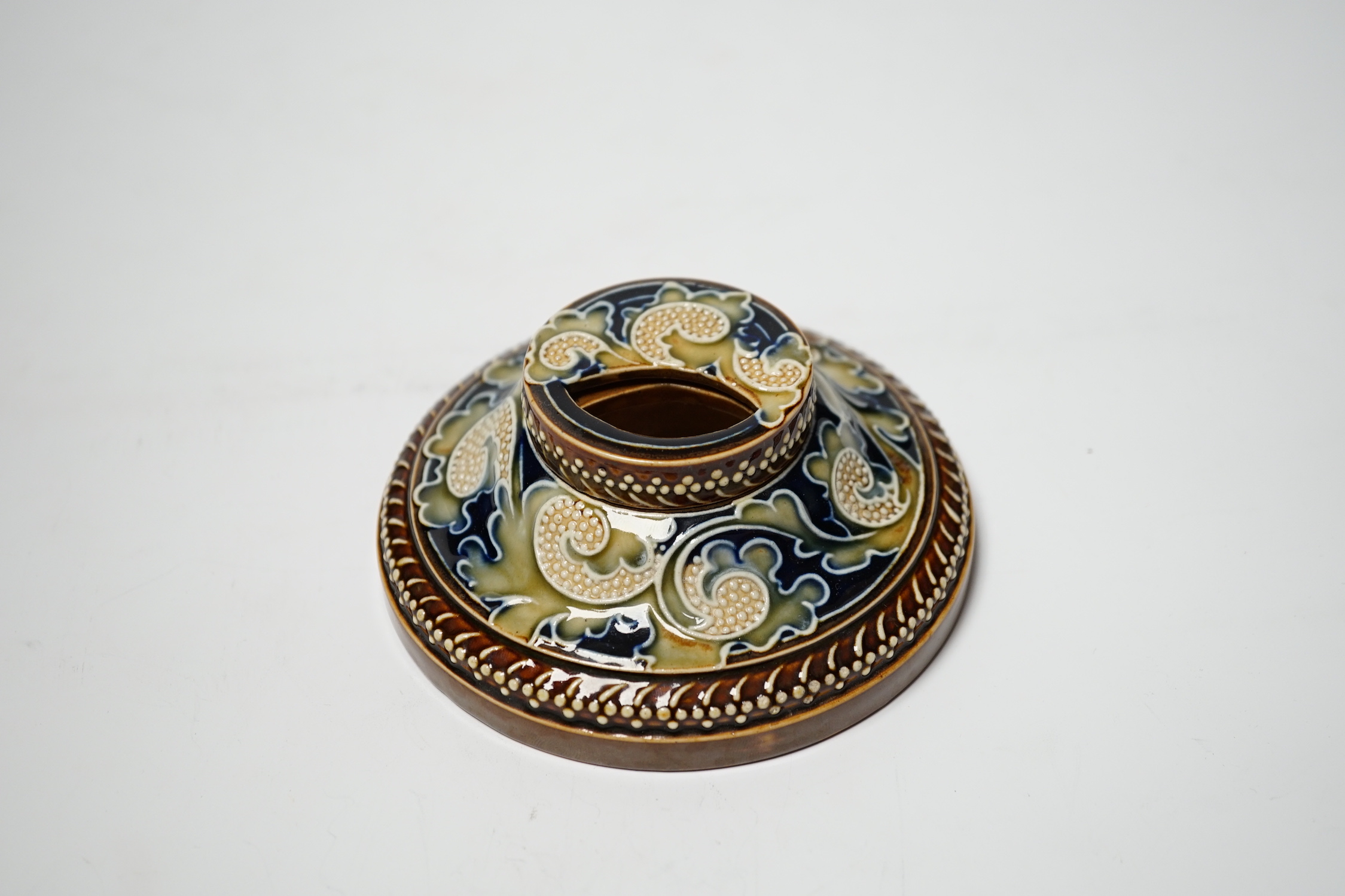 A Doulton Lambeth stoneware inkwell by Mark V. Marshall, 12cm diameter